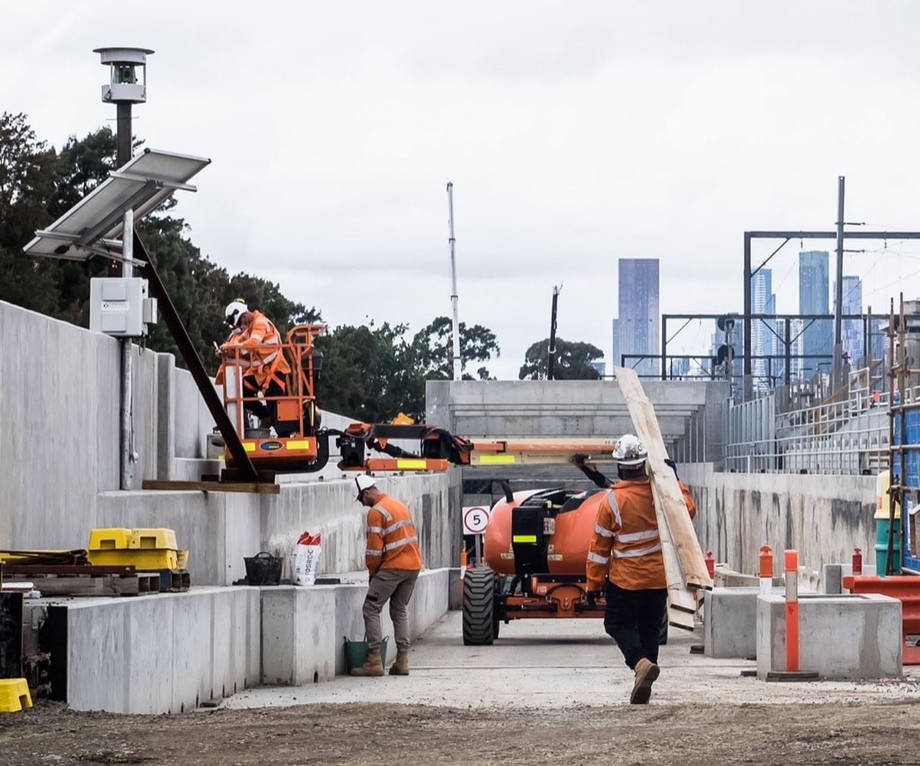 Apprentices working on a large building site near Melbourne CBD