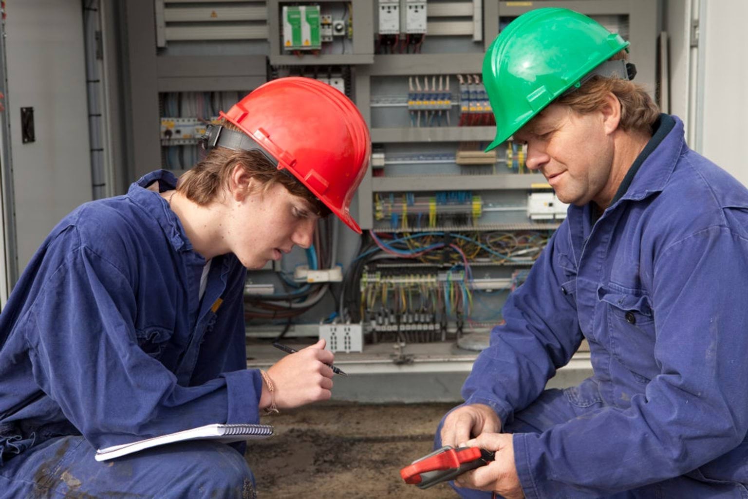 Apprentice working with a mentor in a hands-on training environment.